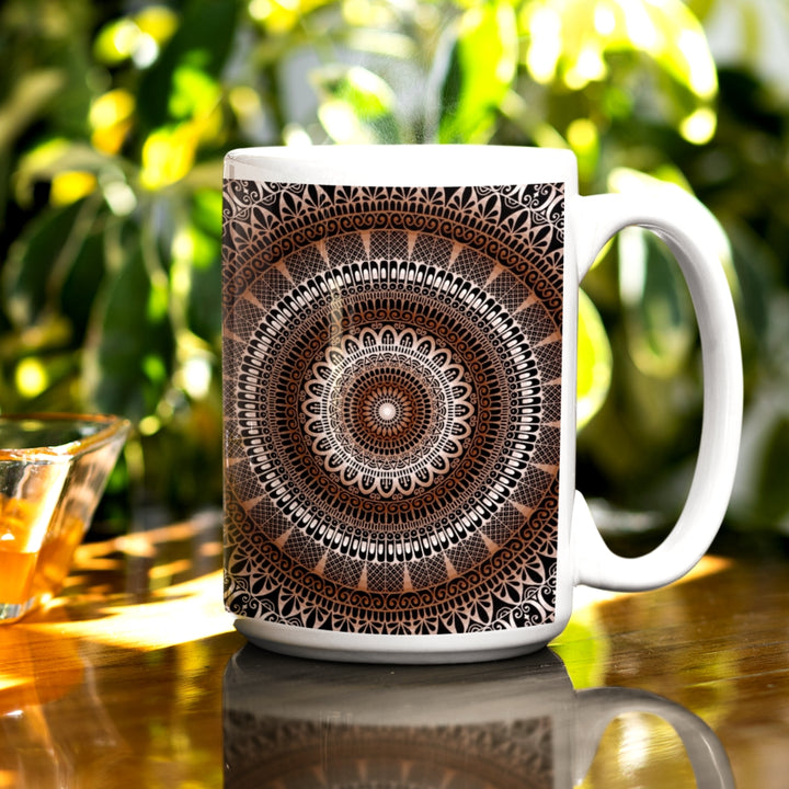 A brown mug adorned with an intricate mandala design