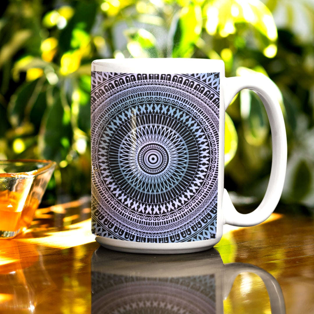 A mandala mug in soft pink and ice blue