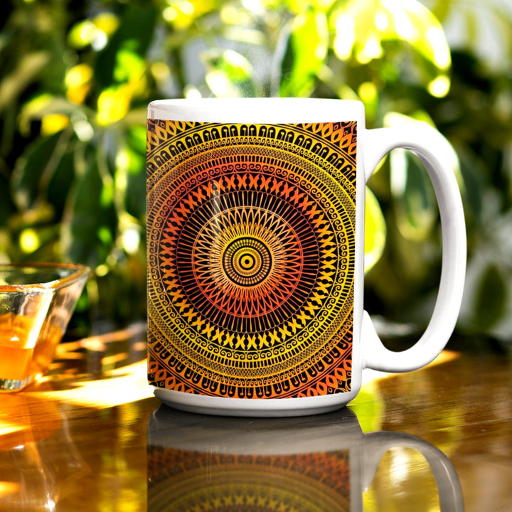 A mandala mug in bright yellow and orange, featuring a lively design that brings playful vibrancy to the visual experience.