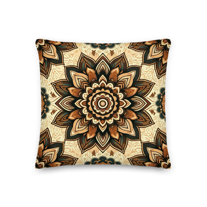 A decorative pillow with a detailed mandala design in warm, earthy tones of brown, gold, and cream, set against a light background.