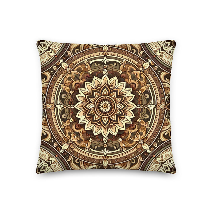 A decorative pillow with a detailed mandala design in rich golden, bronze, and brown hues