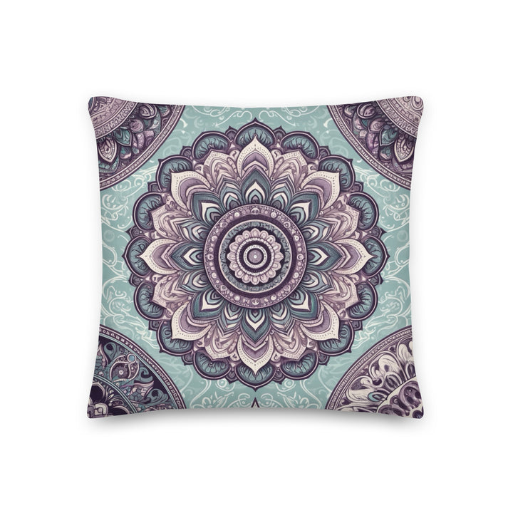 Decorative throw pillow with intricate mandala design in soft blue and vintage pink