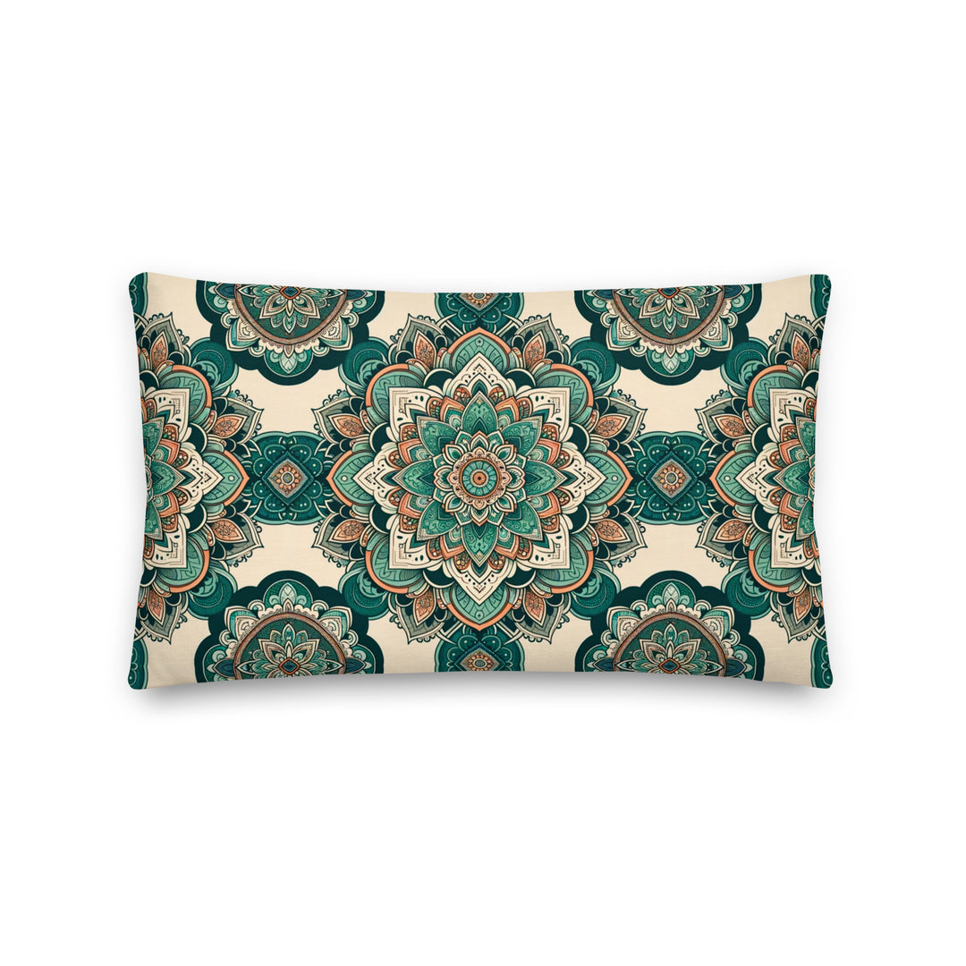 A decorative pillow with intricate mandala designs in shades of green, teal, and earthy tones, set against a light background.