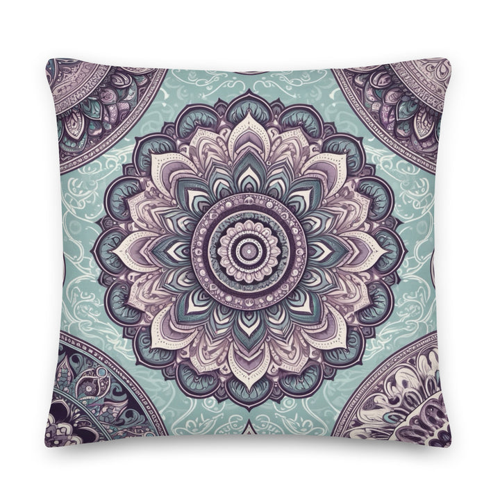 Decorative throw pillow with intricate mandala design in soft blue and vintage pink