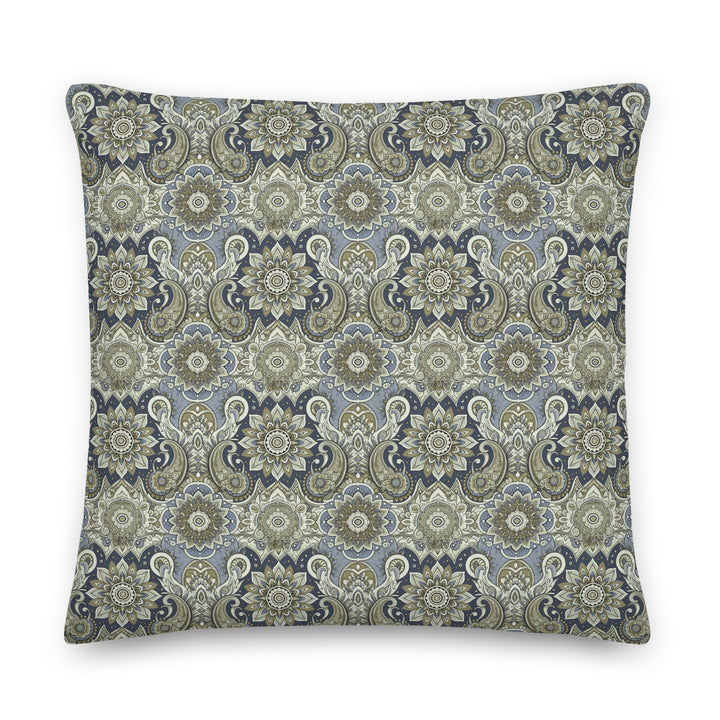 "A decorative lumbar pillow with an intricate paisley and mandala pattern in muted blue, gray, and beige hues