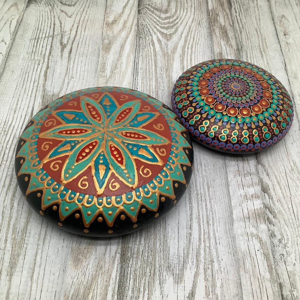 Round mandala stone with smooth, glossy finish, painted in warm Southern-inspired colors of turquoise, red, and gold.