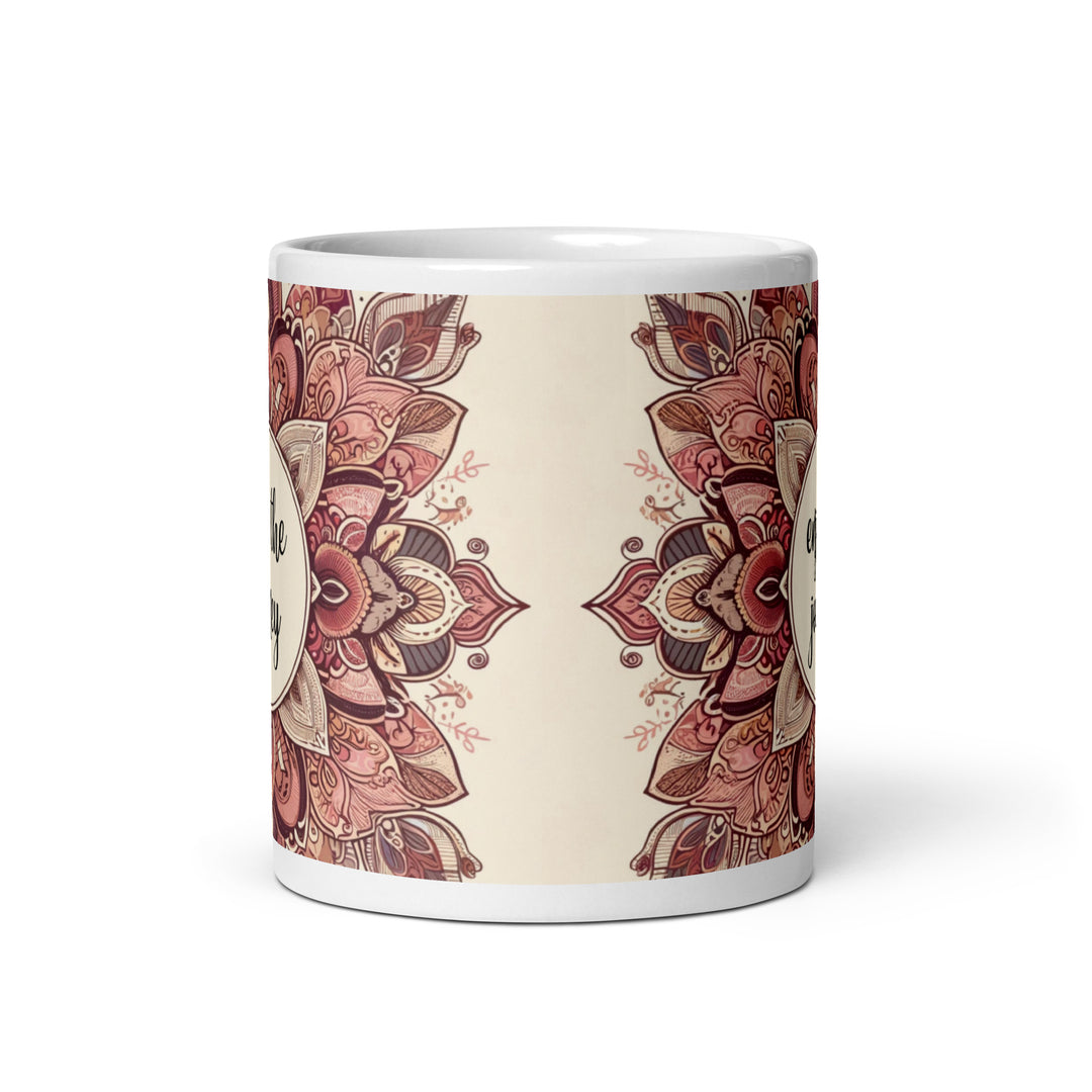 White ceramic mug with a detailed pink and brown mandala design and the phrase 'Enjoy the Journey' in the center