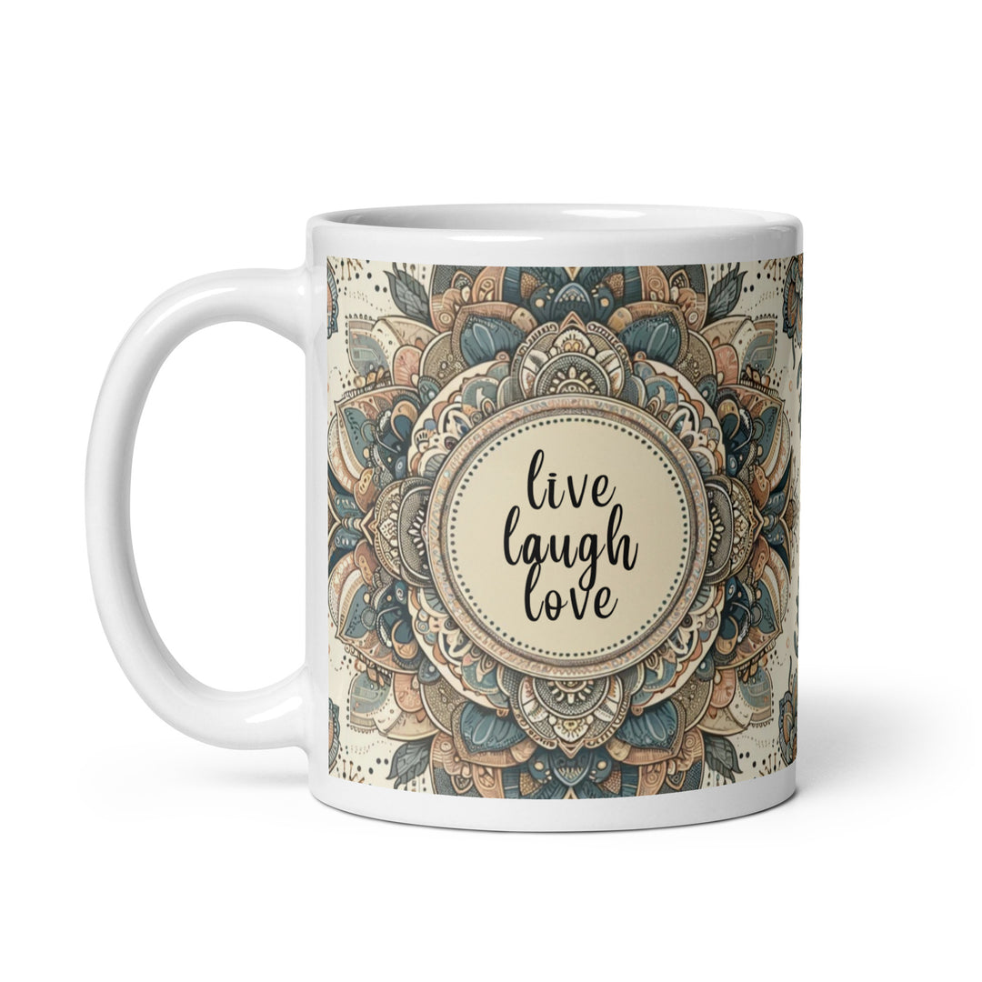 White ceramic mug with a detailed blue and beige mandala design and the phrase 'Live Laugh Love' in the center.