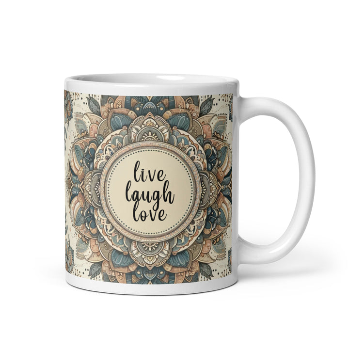 White ceramic mug with a detailed blue and beige mandala design and the phrase 'Live Laugh Love' in the center.