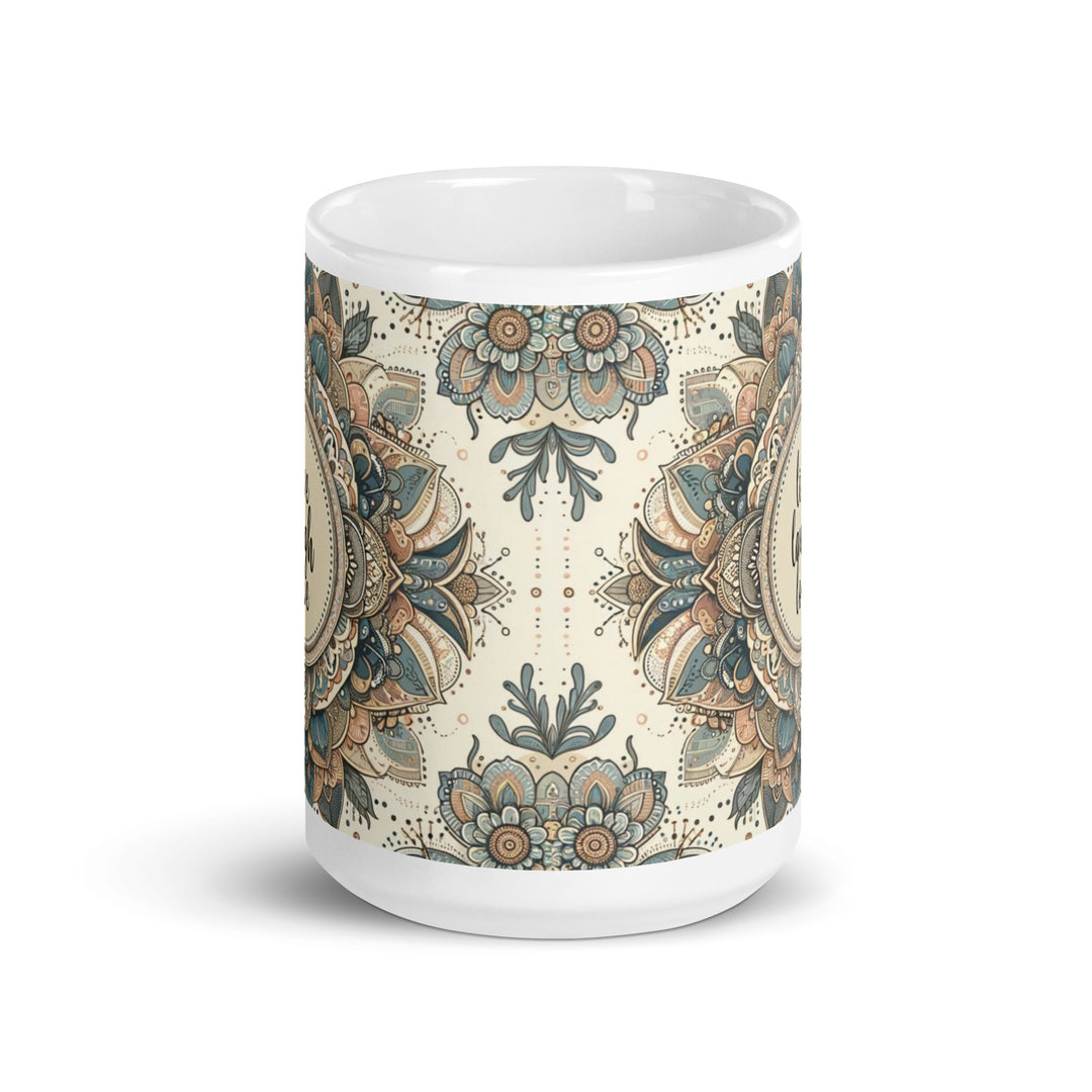 White ceramic mug with a detailed blue and beige mandala design and the phrase 'Live Laugh Love' in the center.