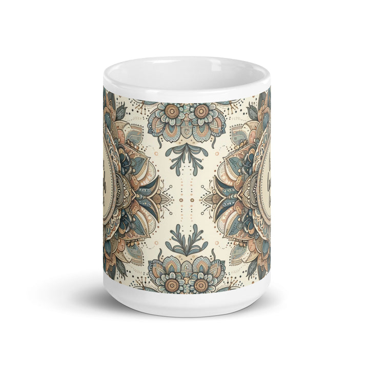 White ceramic mug with a detailed blue and beige mandala design and the phrase 'Live Laugh Love' in the center.