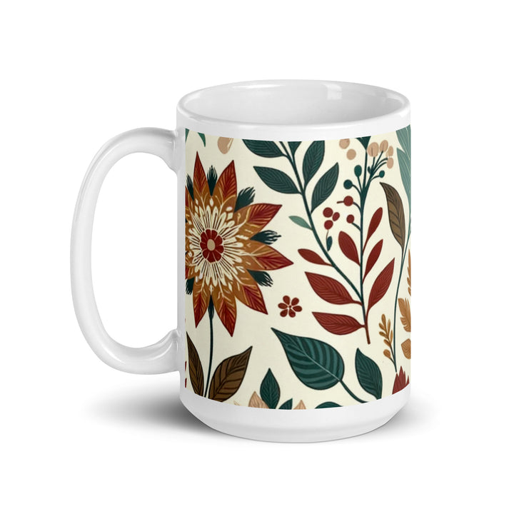 White ceramic mug with a vintage-inspired floral pattern featuring green, brown, and orange flowers and leaves.