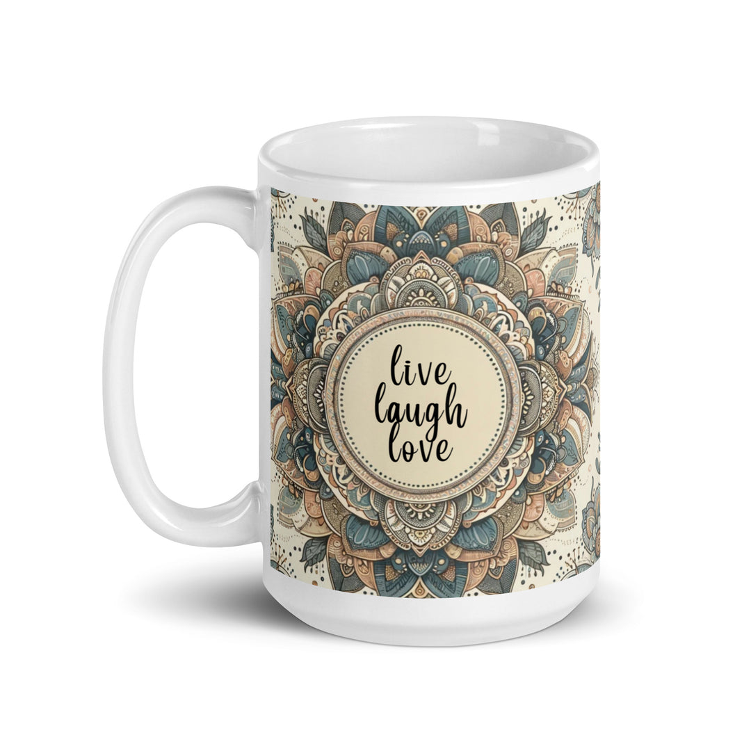 White ceramic mug with a detailed blue and beige mandala design and the phrase 'Live Laugh Love' in the center.