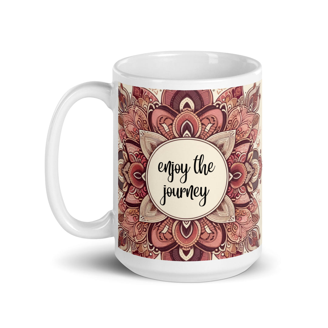 White ceramic mug with a detailed pink and brown mandala design and the phrase 'Enjoy the Journey' in the center