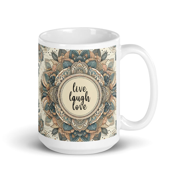 White ceramic mug with a detailed blue and beige mandala design and the phrase 'Live Laugh Love' in the center.