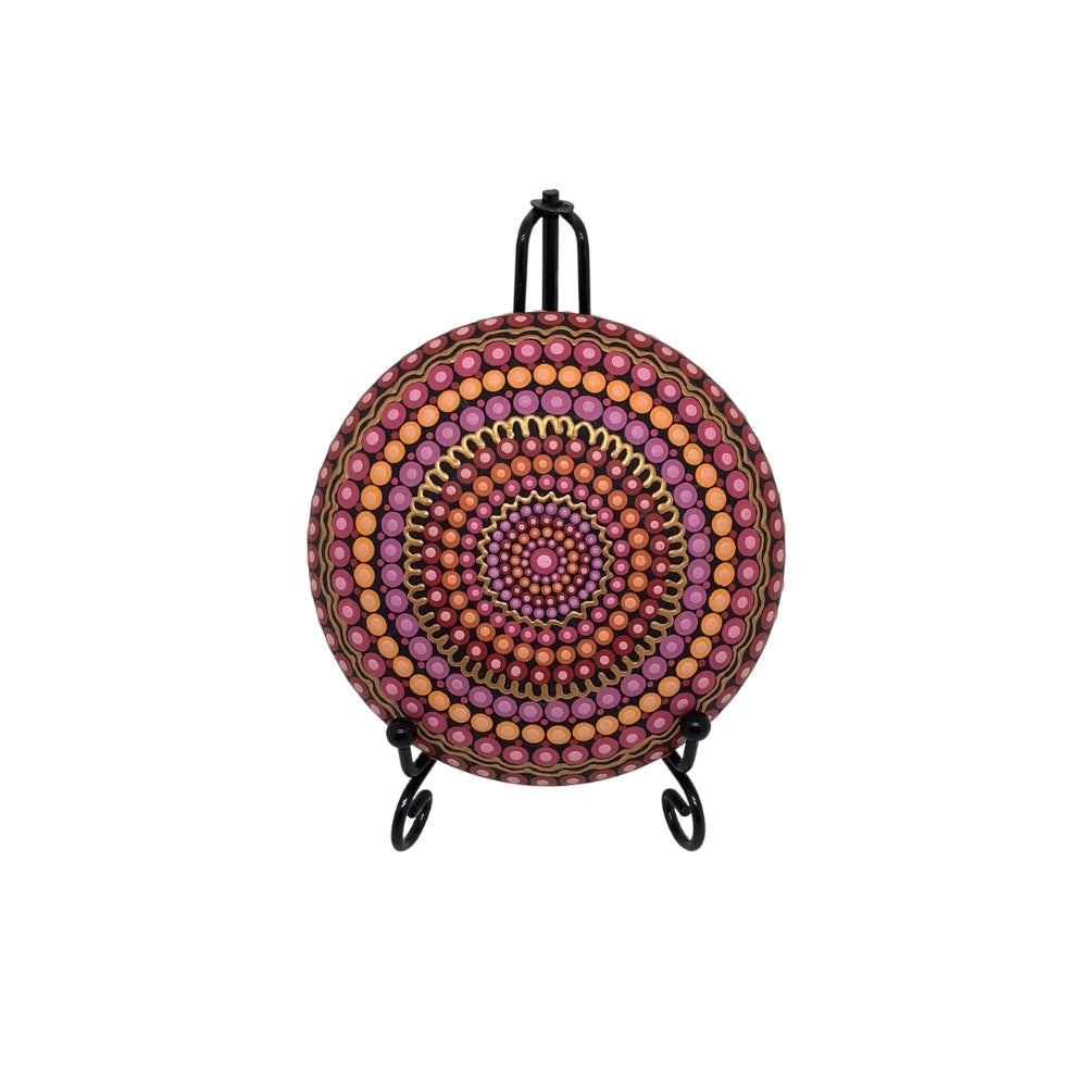 Dot painted mandala stone in pink, orange, red and gold